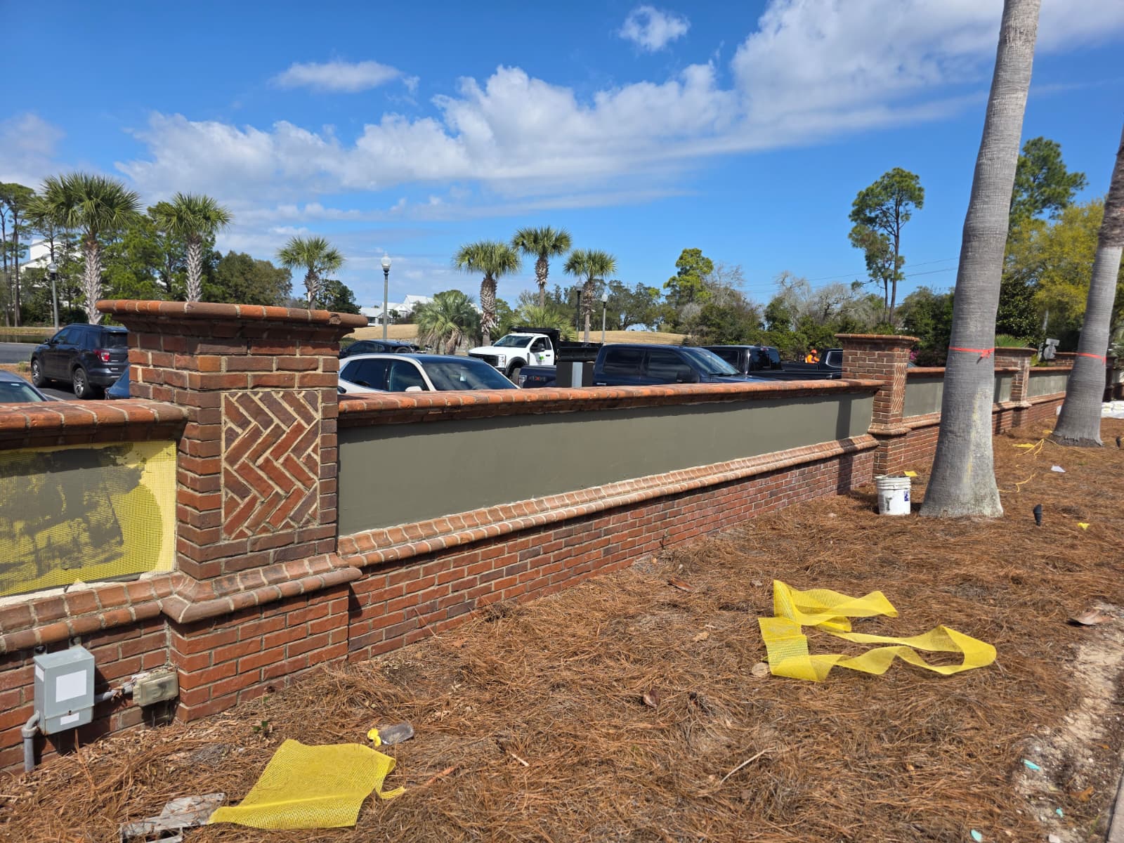 Crew hand-applying stucco on commercial wall