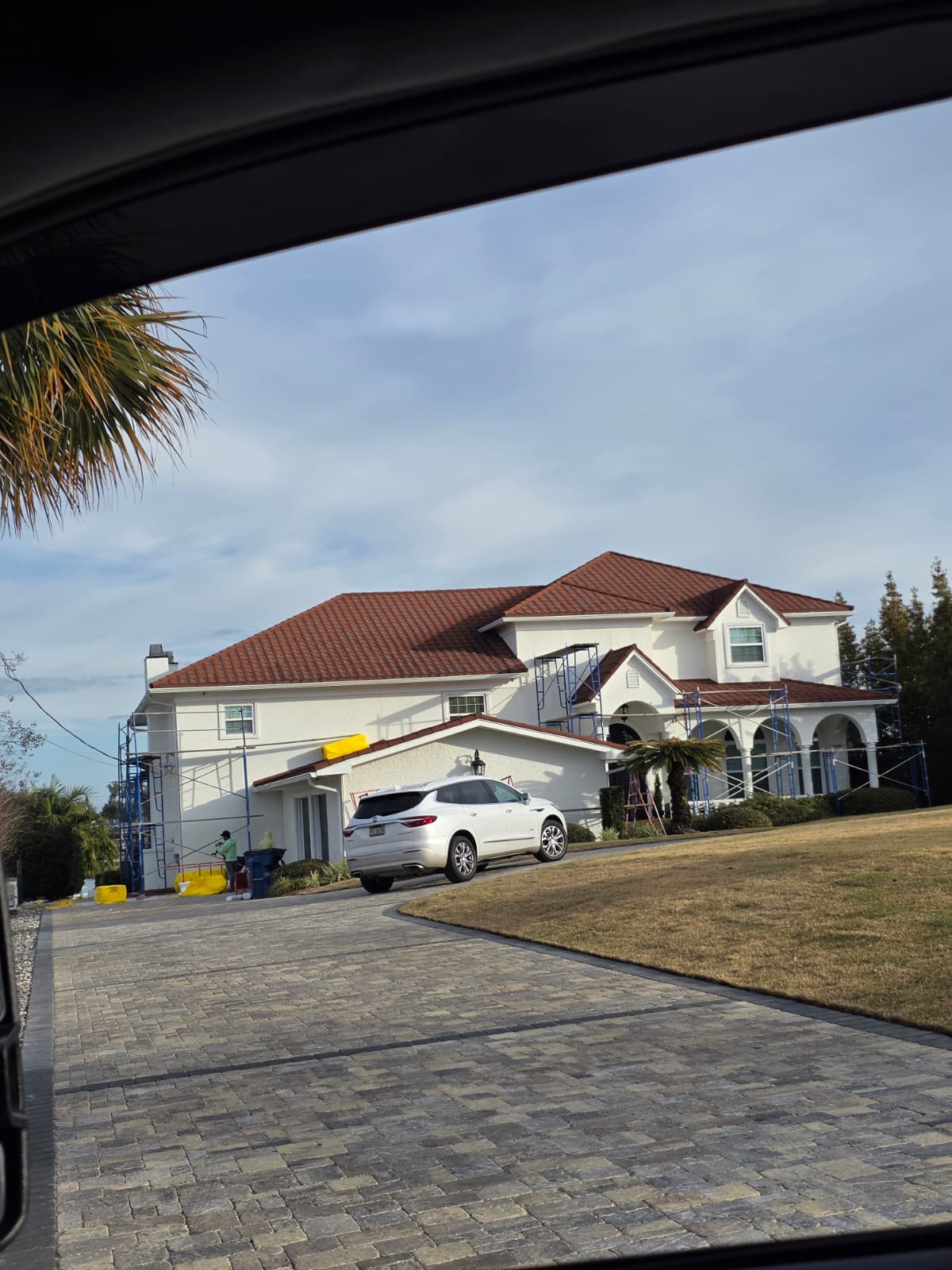 K&C truck with scaffolding at large custom home