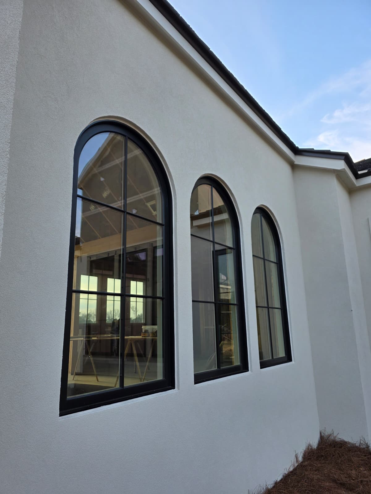 Smooth stucco with arched windows