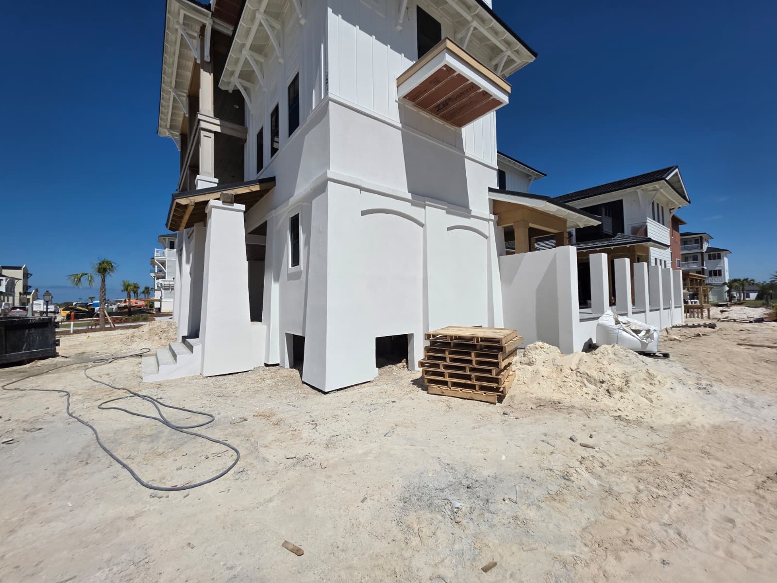 New construction stucco with arched columns