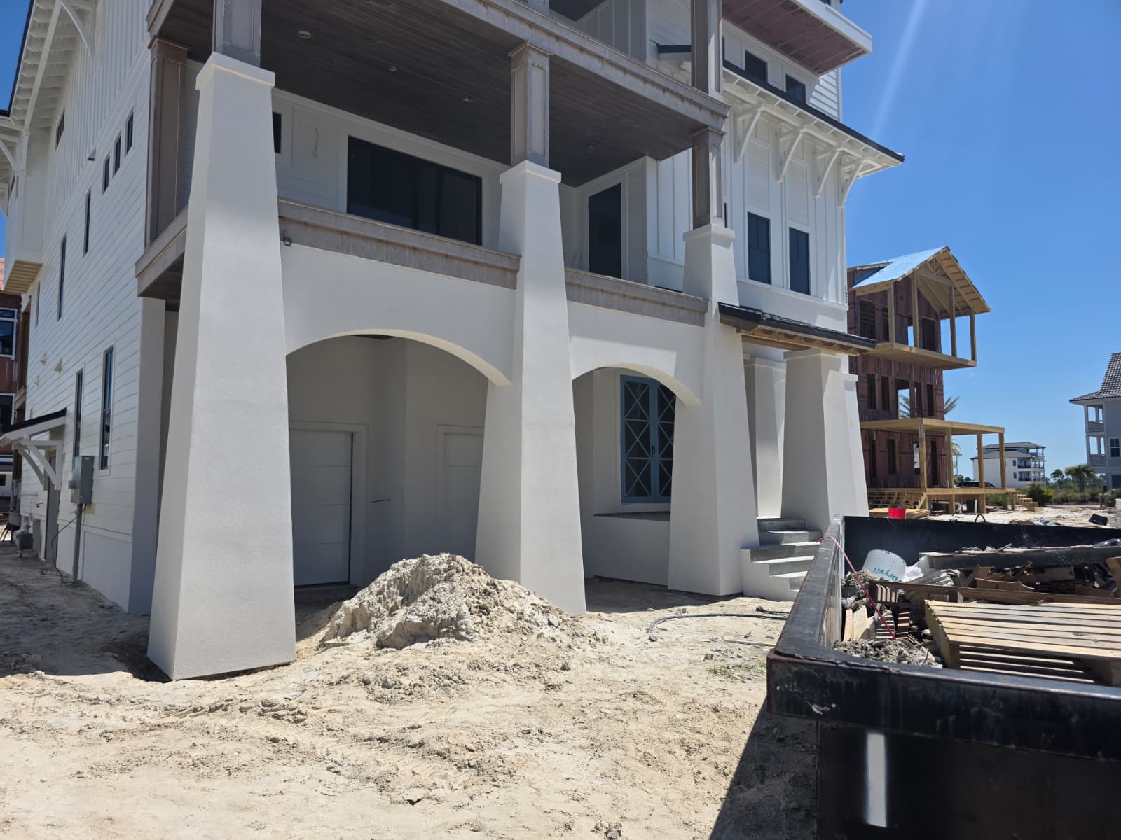 Multi-story condo stucco with decorative tower