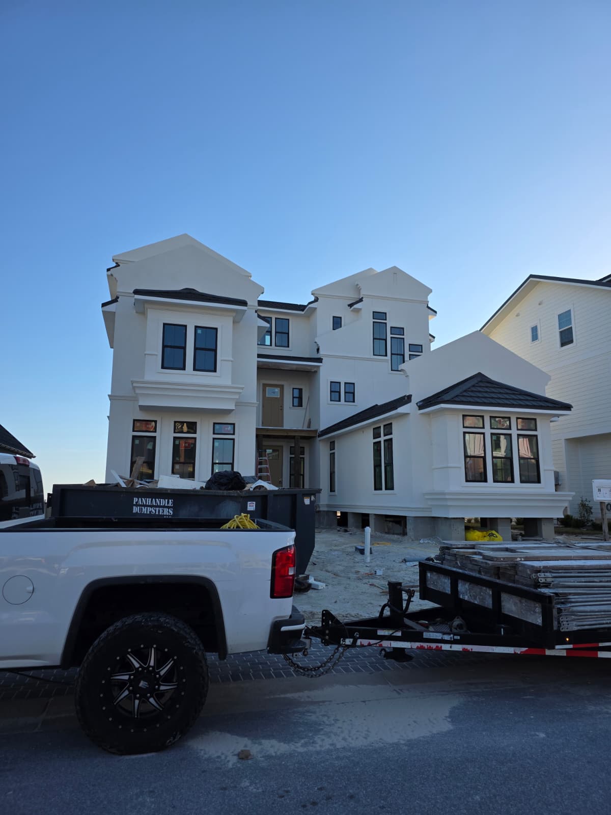 Multi-story coastal home with decorative stucco
