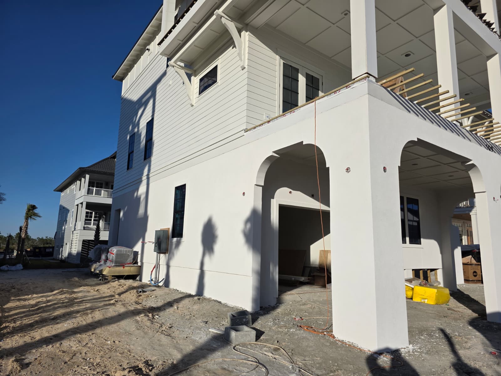 New construction stucco with arched entryway