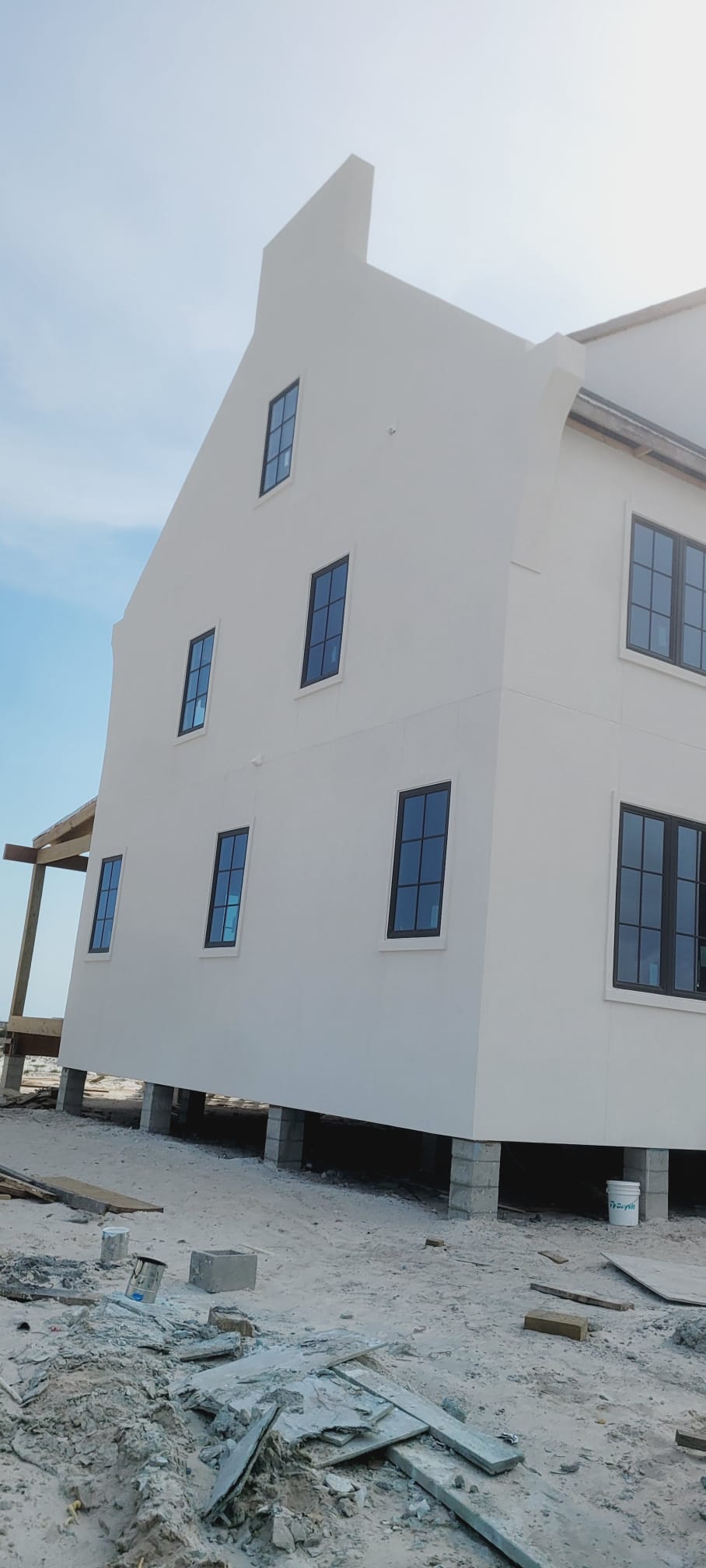 Finished Alys Beach style home with stucco