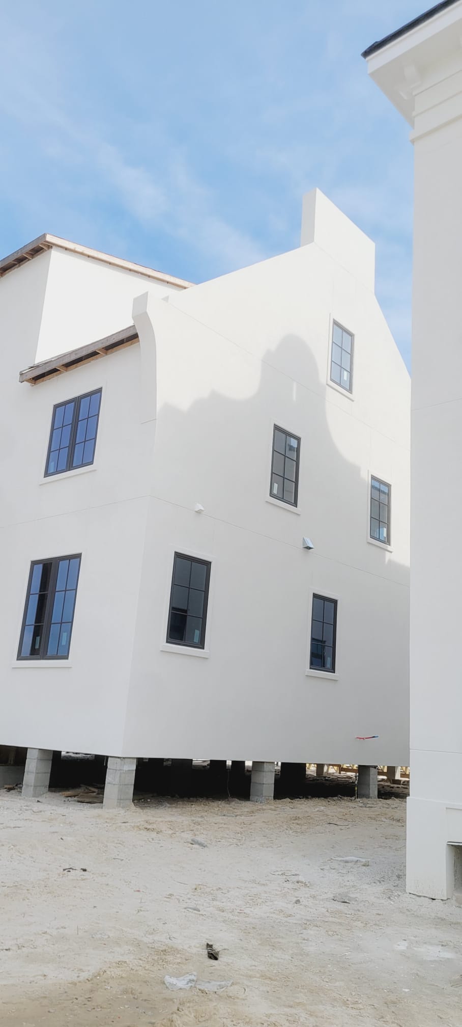 White stucco house under construction